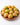 Mangoes in a wooden bowl on a white background